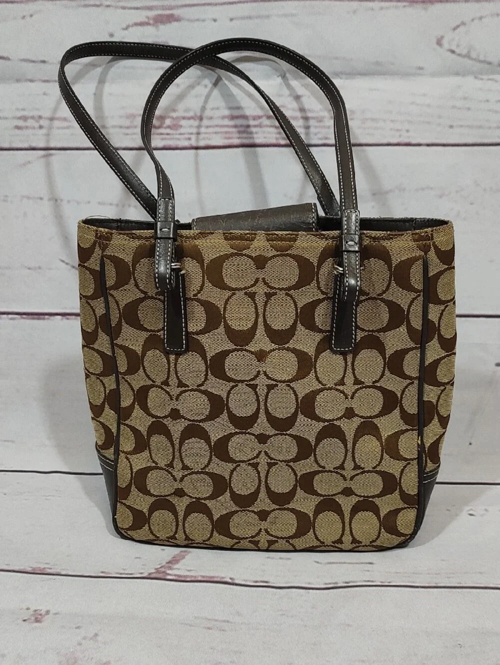 Coach iconic signature